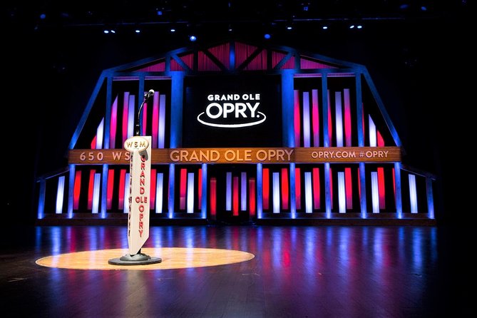 Grand Ole Opry stage with purple and pink lights and microphone