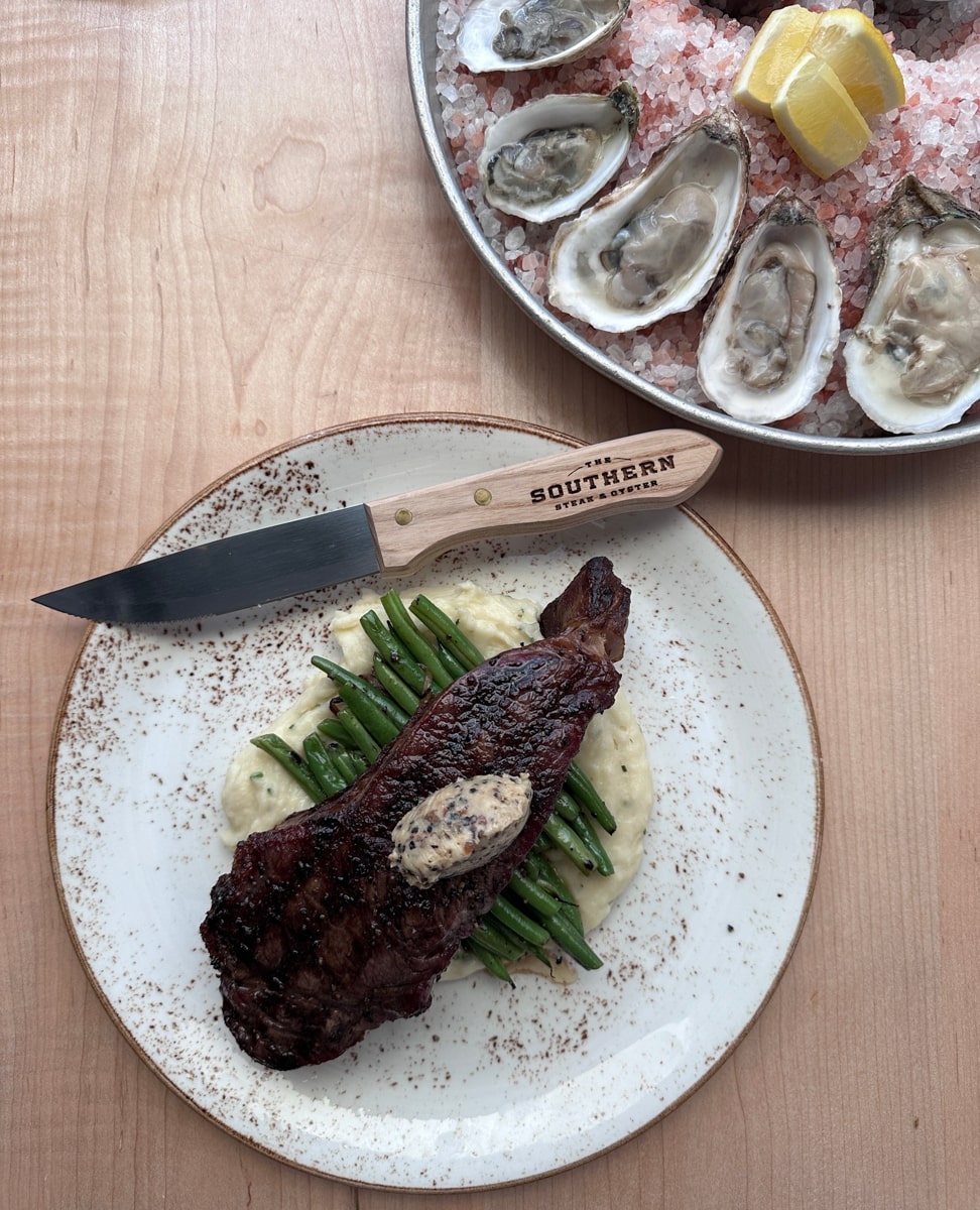 steak and asparagus with raw oysters at southern steak & oyster in nashville tn 