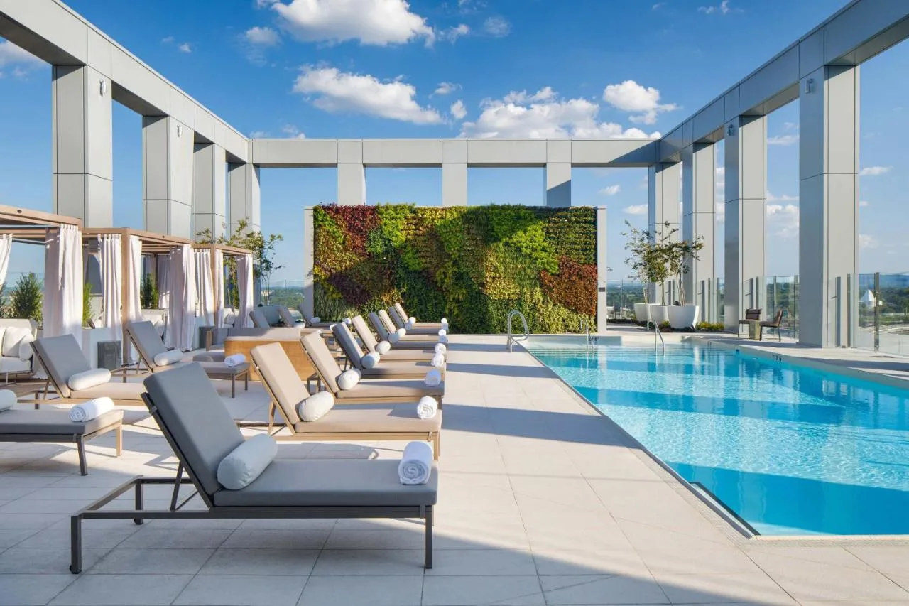 lounge chairs and cabanas by the pool on the rooftop of the joseph hotel in nashville tn 