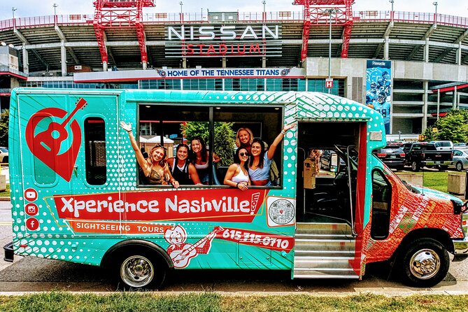 girls in an xperience nashville tour in front of the nissan stadium in nashville tn 