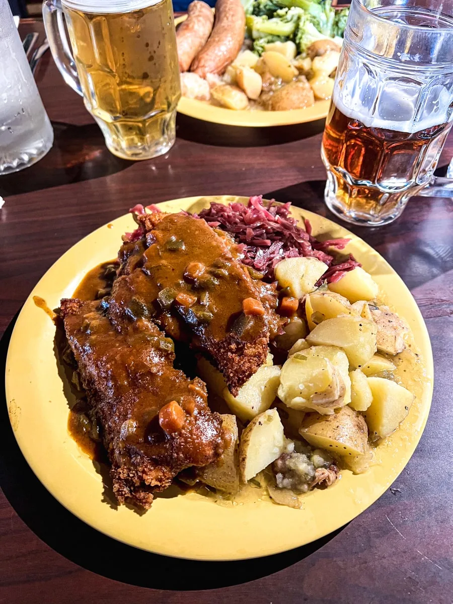 paprika chicken schnitzel with potato salad and red cabbage at freibergs in johnson city as one of the best places to eat