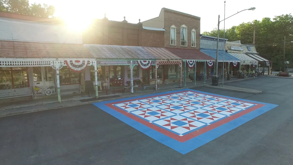 downtown bell buckle small town in tennessee with a large quilt painted on the road