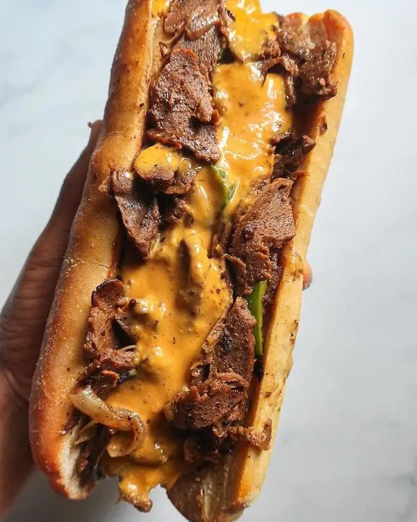 philly cheesesteak with melted cheese and green peppers