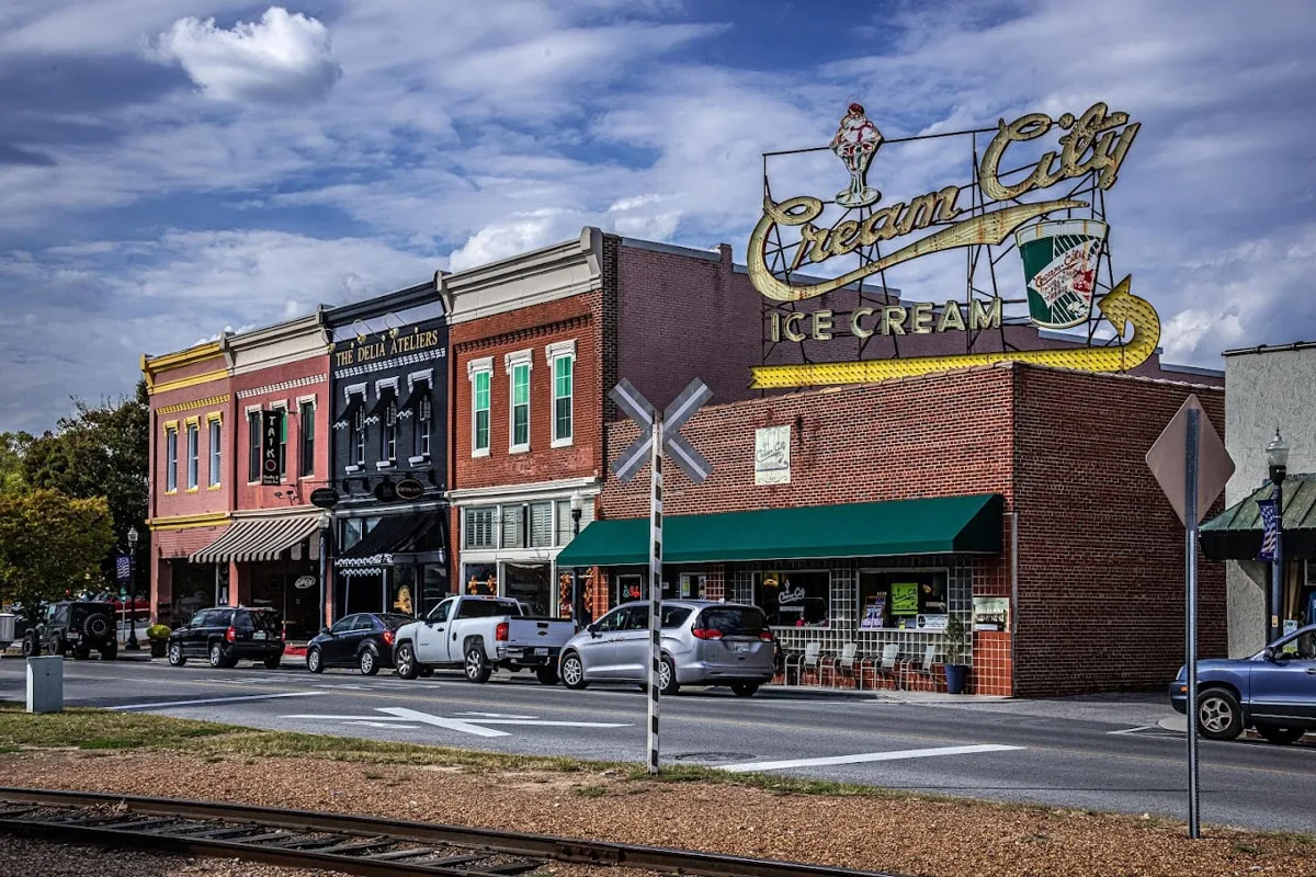 downtown cookeville with giant cream city ice cream sign on top of building 