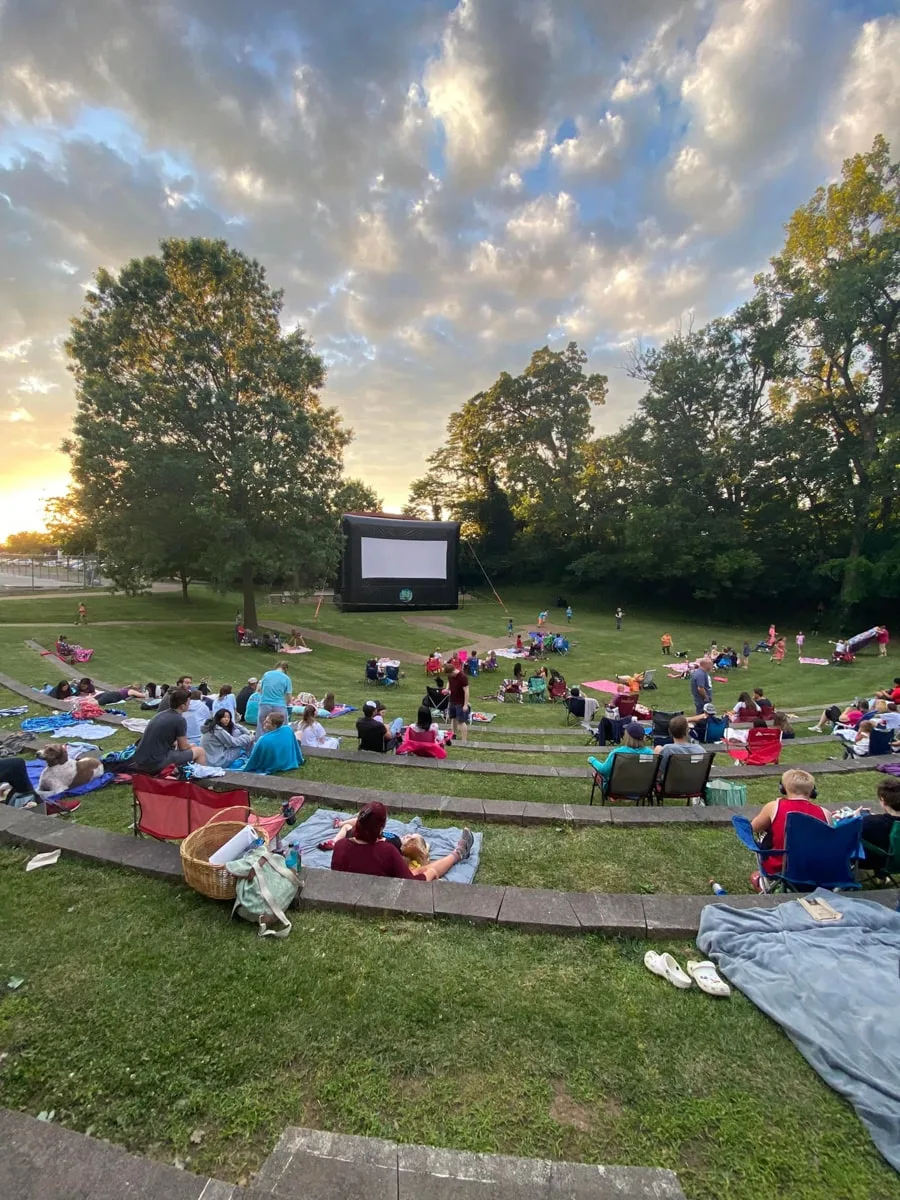 people sitting at dogwood park looking at an outdoor screen for movies for something to do in cookeville