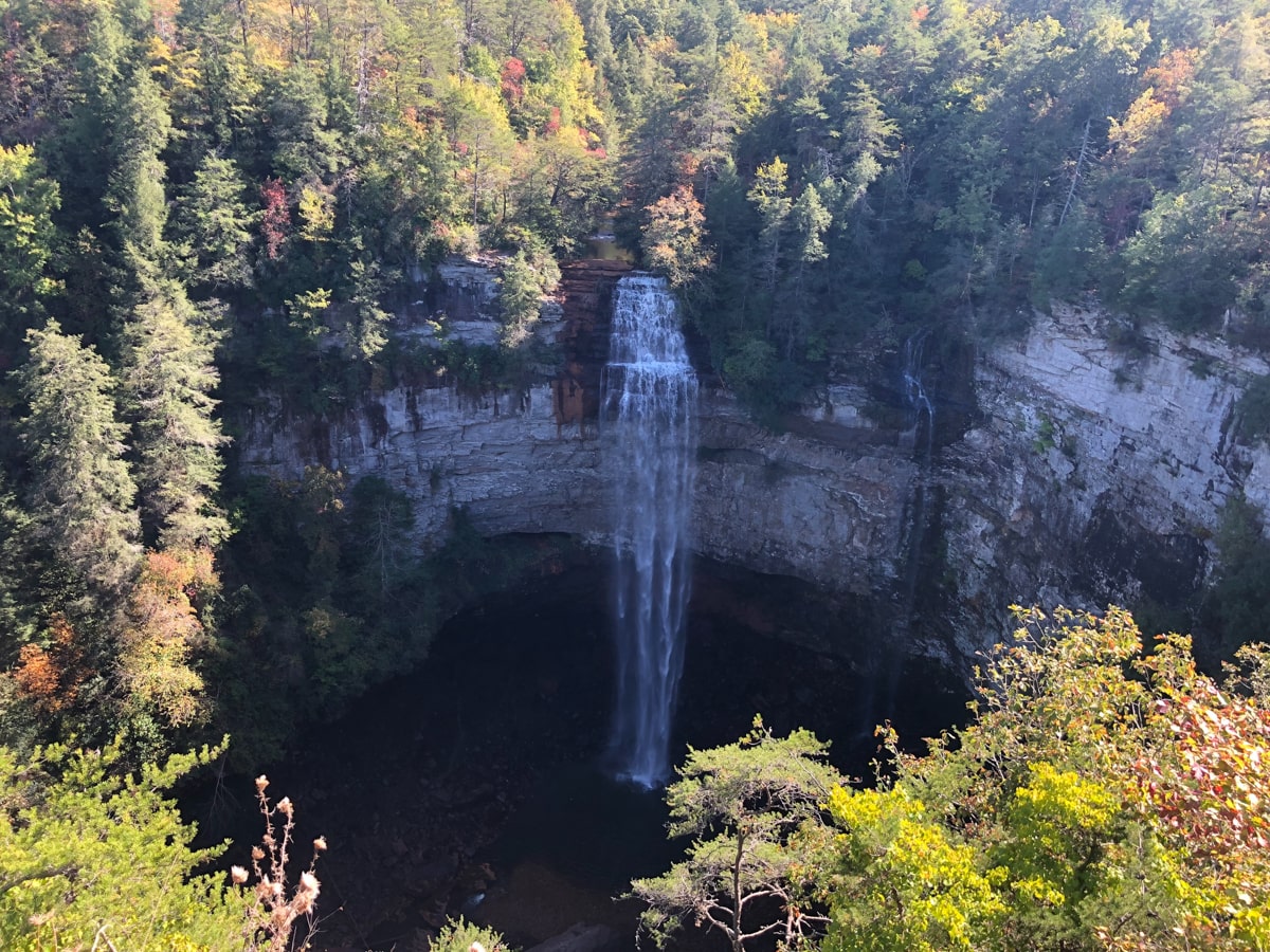 fall creek falls surrounded by colorful fall foliage trees at fall creek falls state park in small town of spencer tn