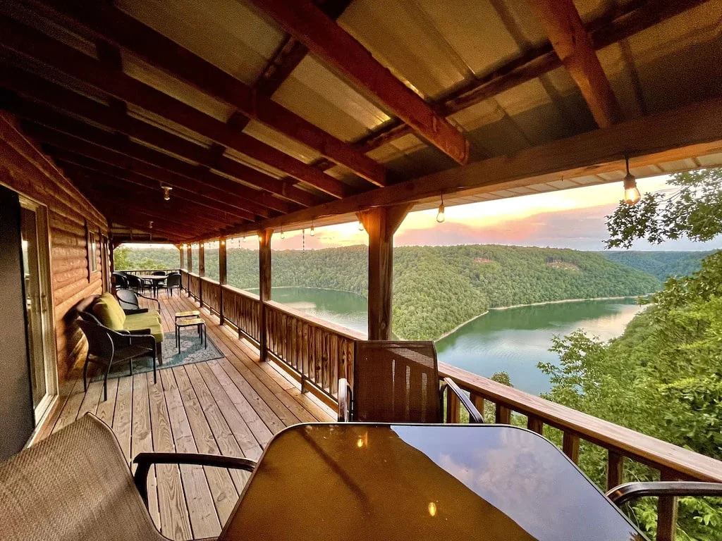 cabin porch with seating overlooking the lake at sunset near cookeville tn 