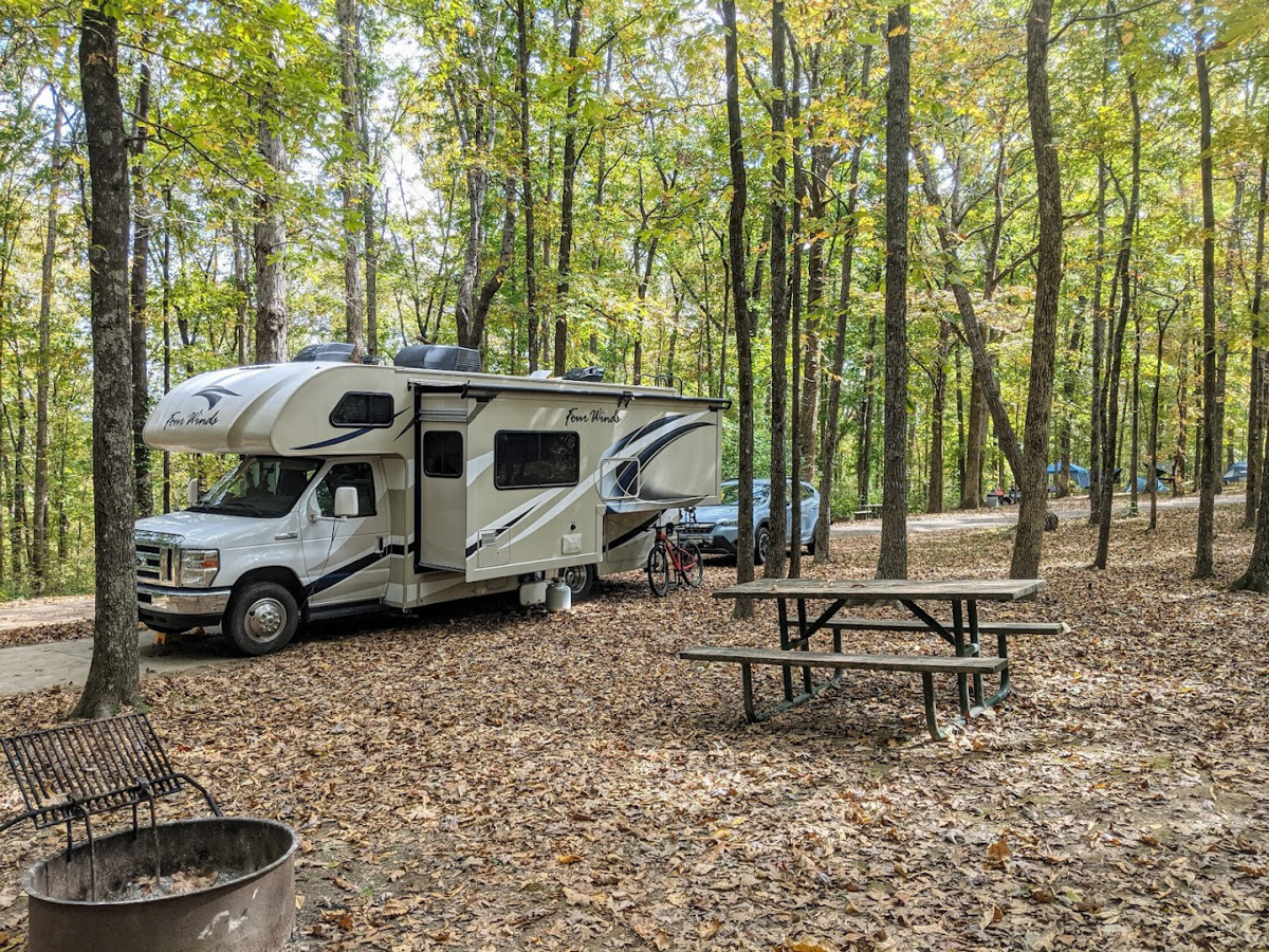 rv camper with bicycle and firepit at meriweather lewis campground near nashville tn 