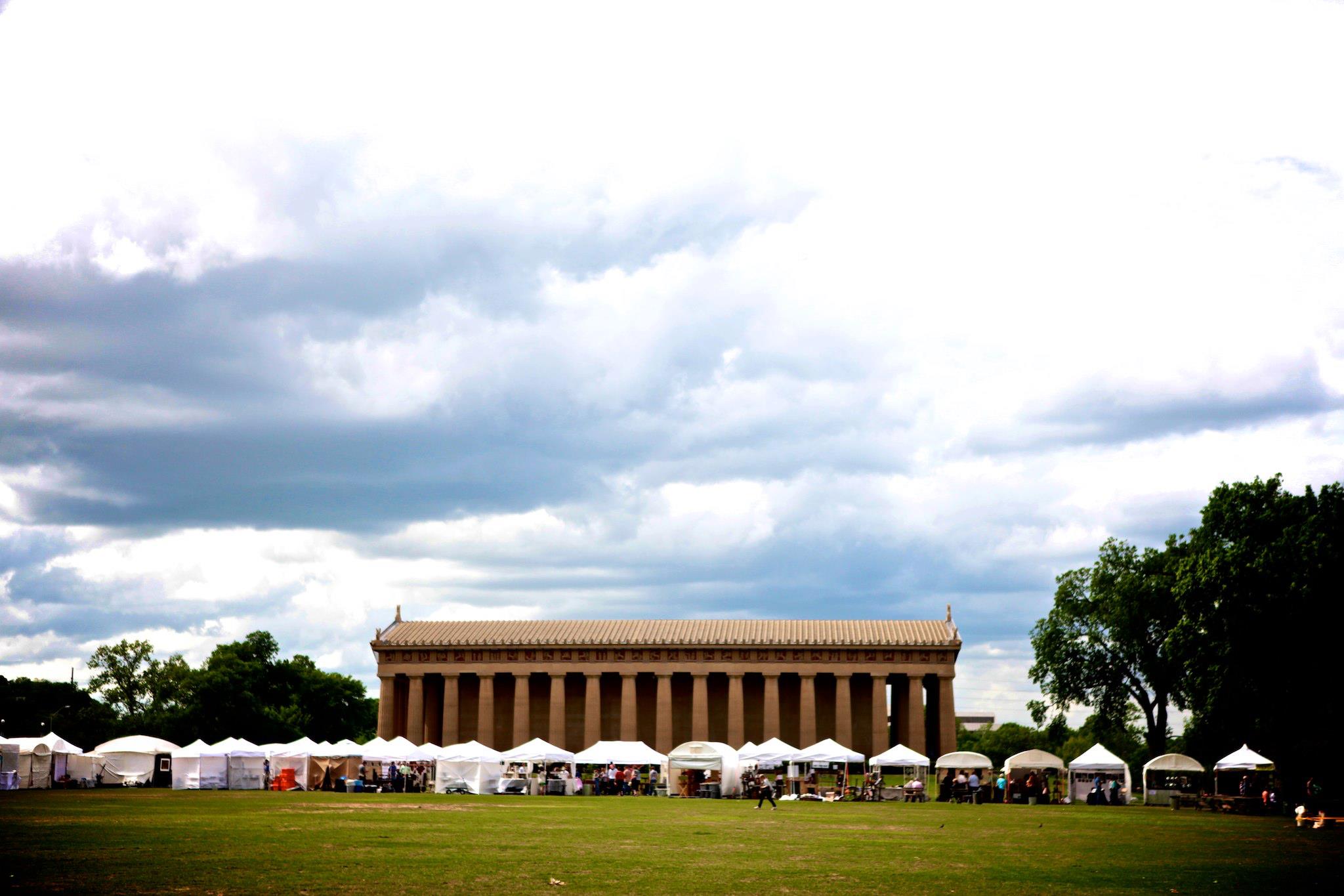 centennial park and craft fair vendors setup in front of the Nashville parthenon as a fun thing to do in Nashville in october