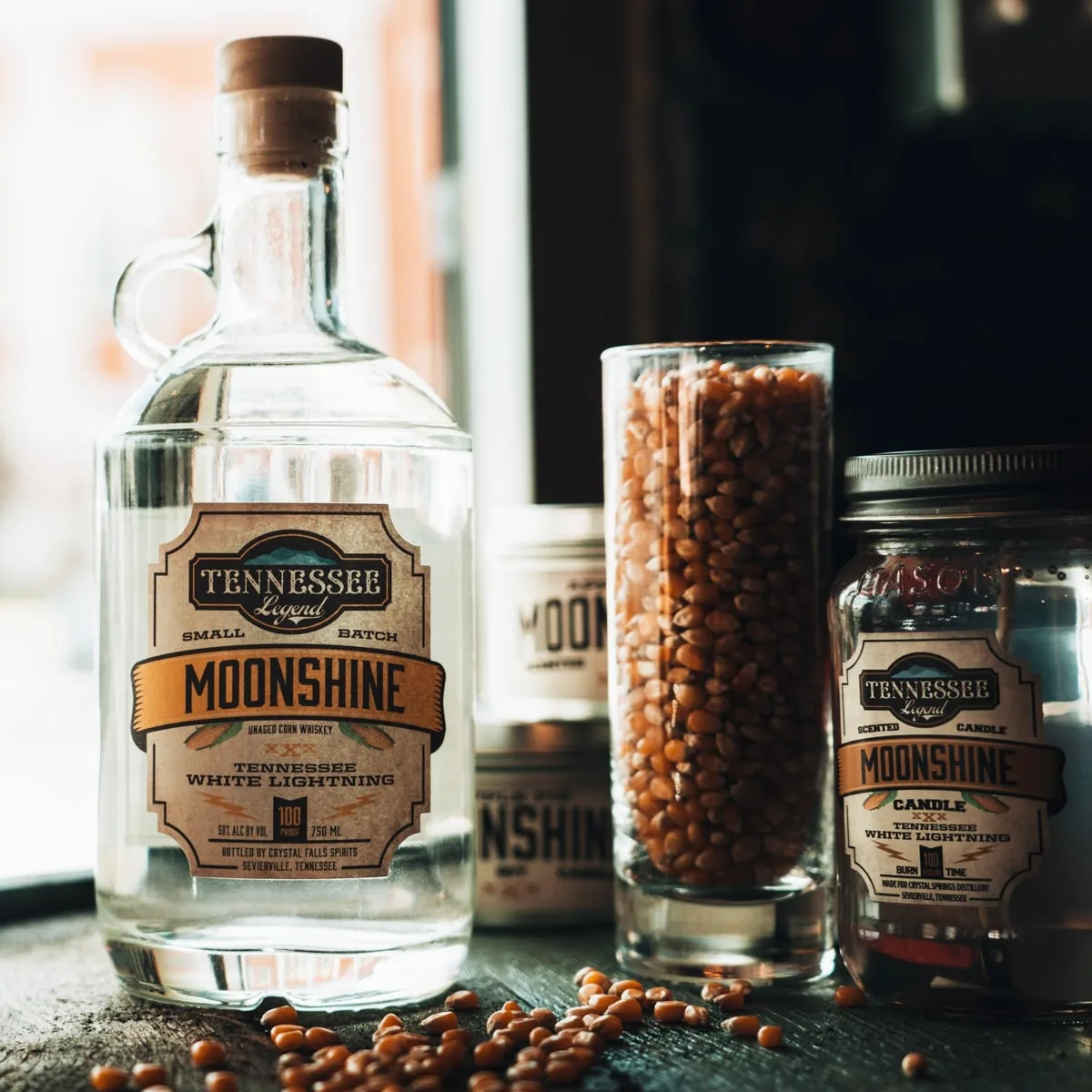 Tennessee White Lightning Moonshine handle bottle with other bottles of moonshine at tennessee legend distillery in cookeville tn 