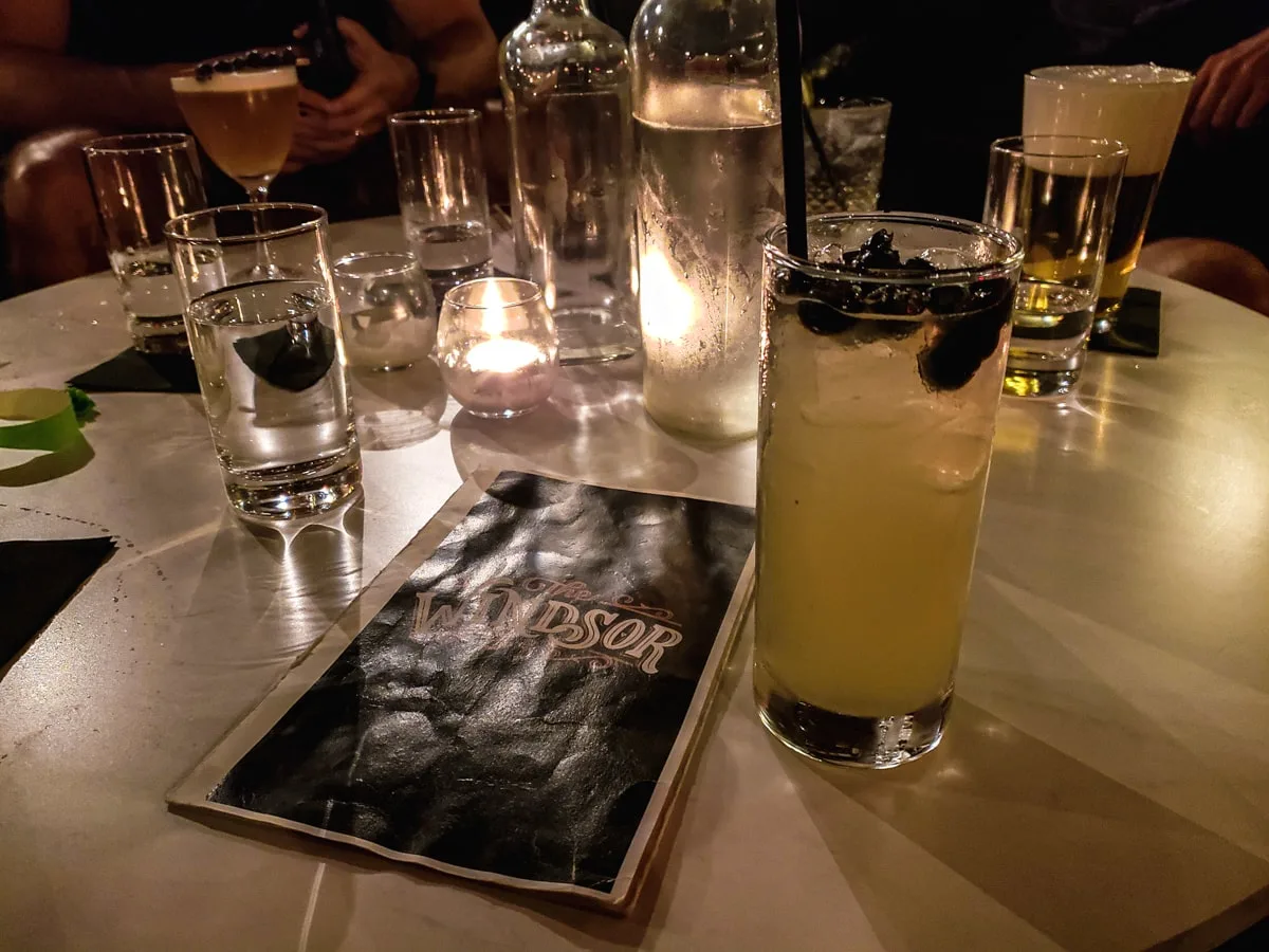 cocktails and menu at windsor speakeasy in downtown johnson city with candle lighting 