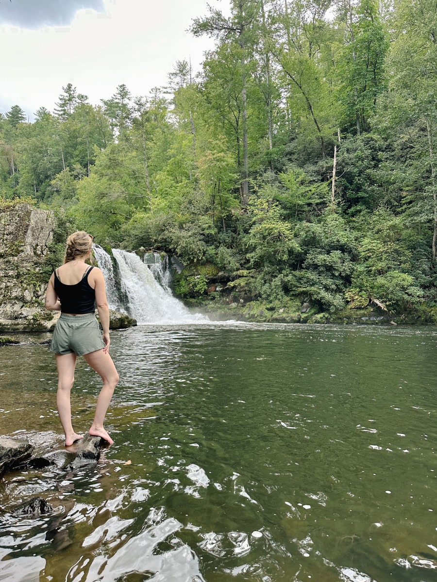 woman standing at abrams falls in cades cove