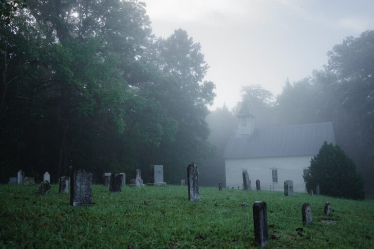 Methodist church and cemetery in cades cove in the early morning surrounded by fog