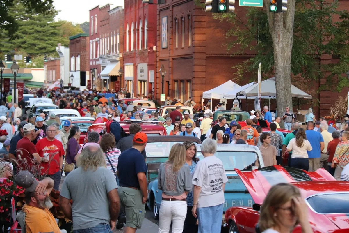 people walking on the square in rogersville tn looking at classic cars 