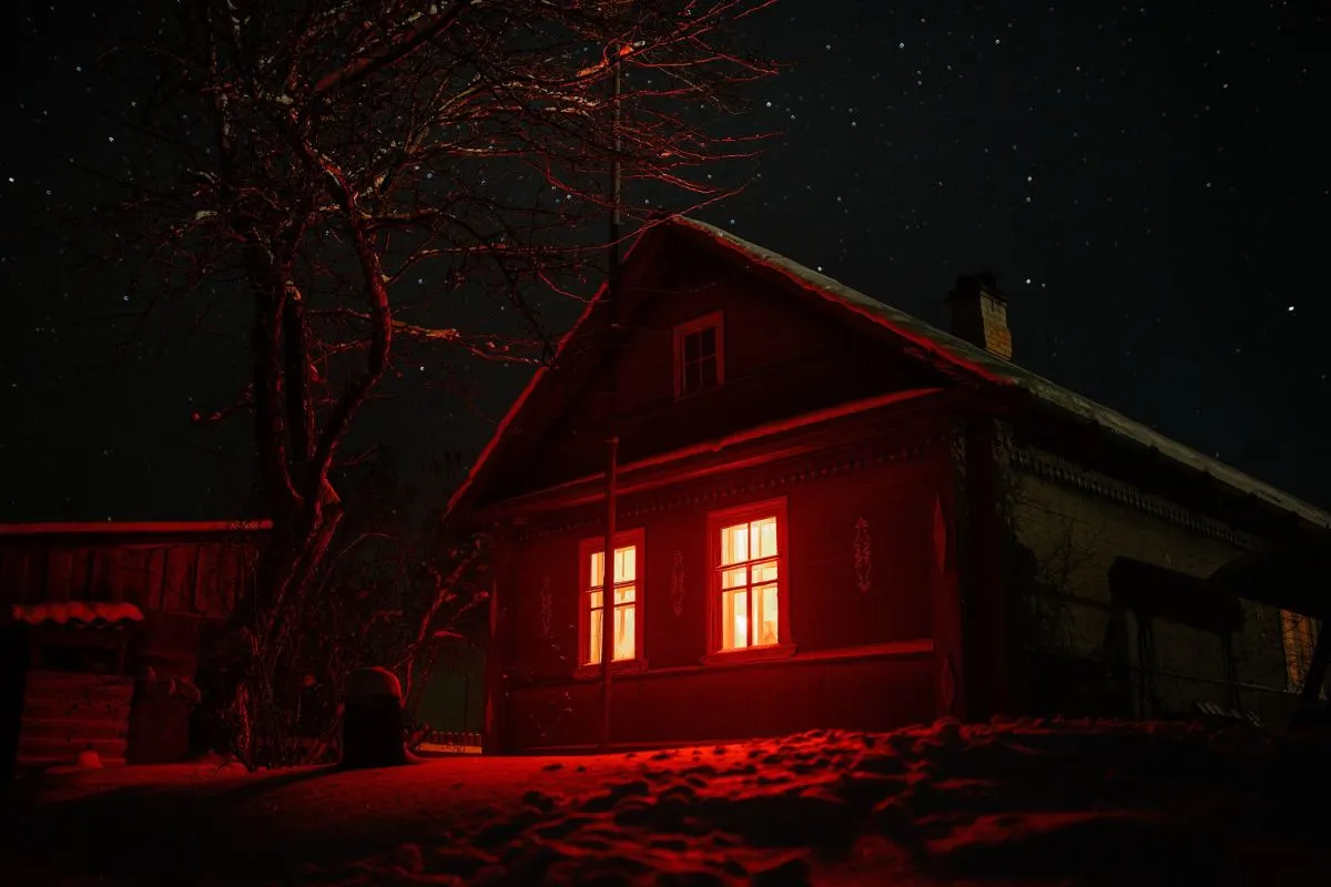 haunted cabin at night with red lights 