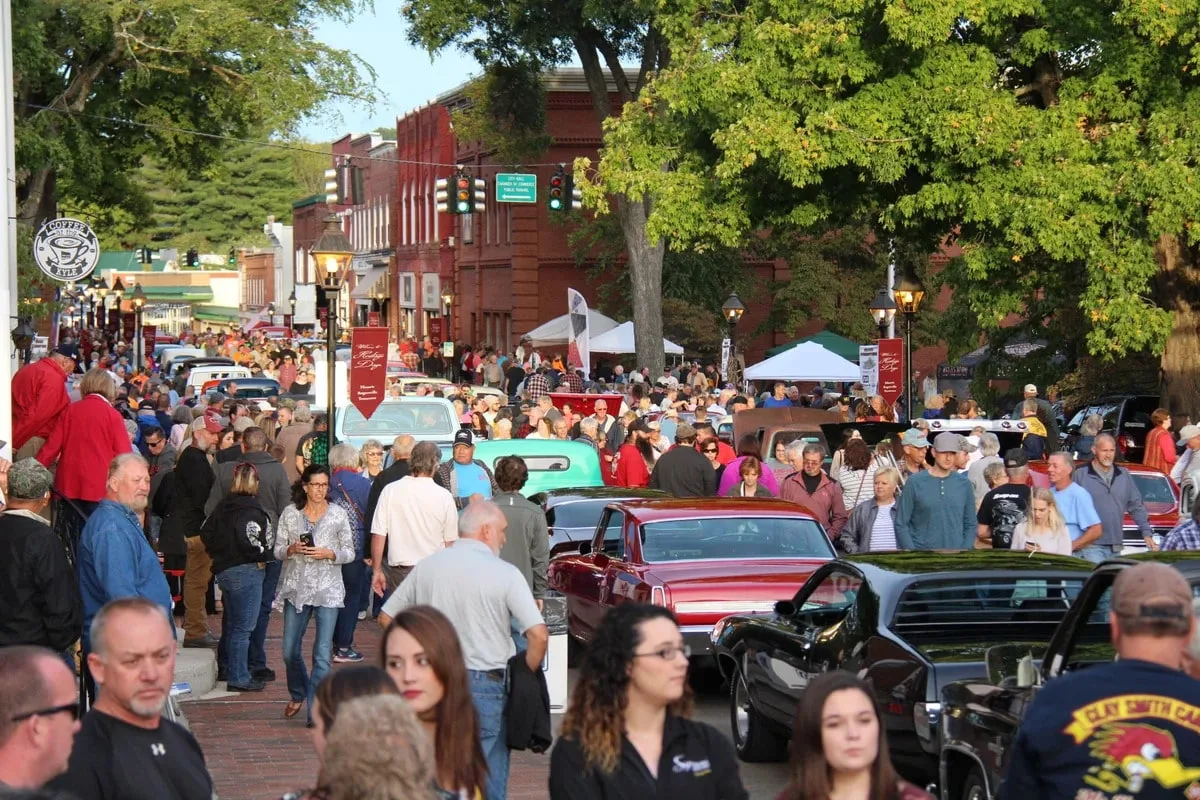 people walking up and down the street in rogersville tn for heritage day festival 