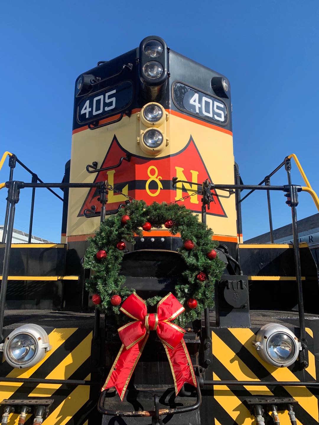 the polar express train in nashville tn with a wreath on the front of the train