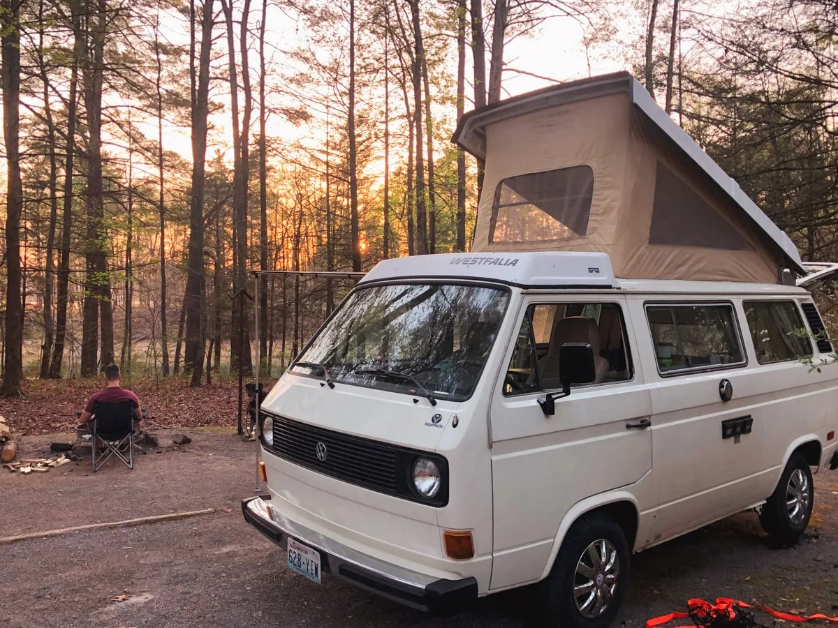 VW Westfalia and man sitting around the campfire at Little Oak Campground at South Holston Lake in Bristol 
