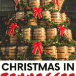 Christmas in Tennessee pinterest pin with a christmas tree made from jack daniels whiskey barrels