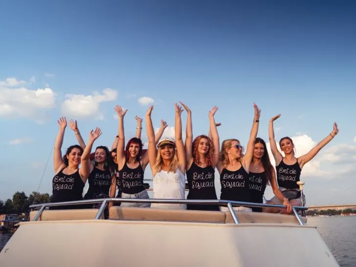 women celebrating a brides bachelorette party on a boat with bride squad outfits