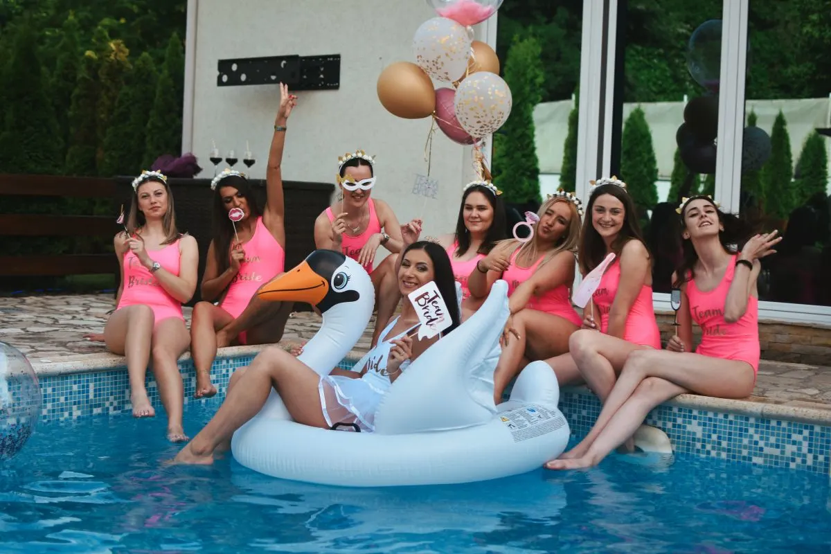 ladies celebrating a bachelorette party by the pool 