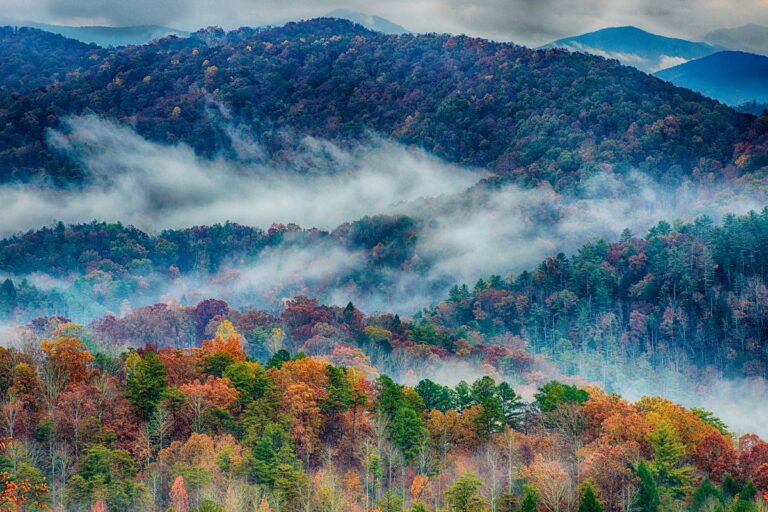 Smoky Mountains with clouds and leaves changing colors for the fall season
