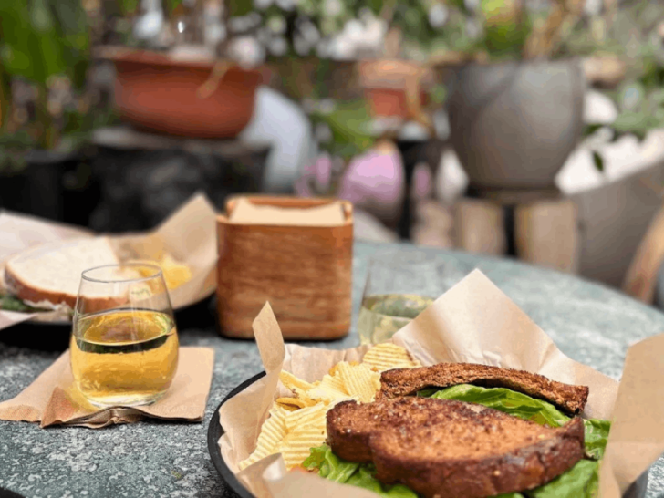 This Hidden Oasis in Tennessee Is a Greenhouse Bar Where Vines Surround Every Table
