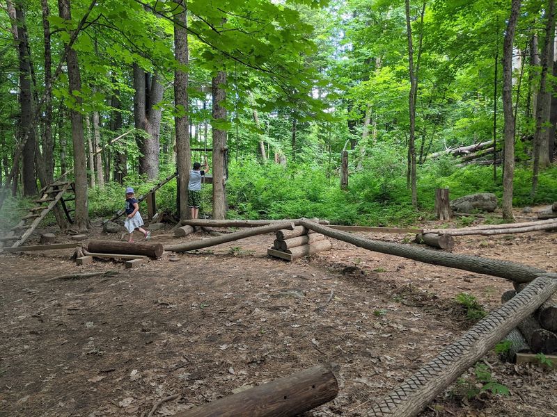 Playful obstacles and trail features keep kids engaged