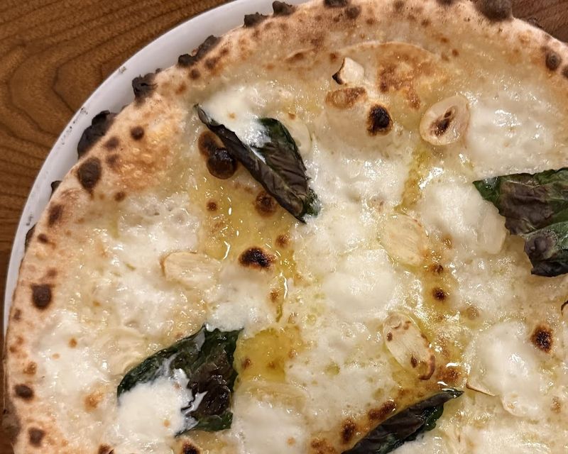 The Wood-Fired Crust That Defines the Experience