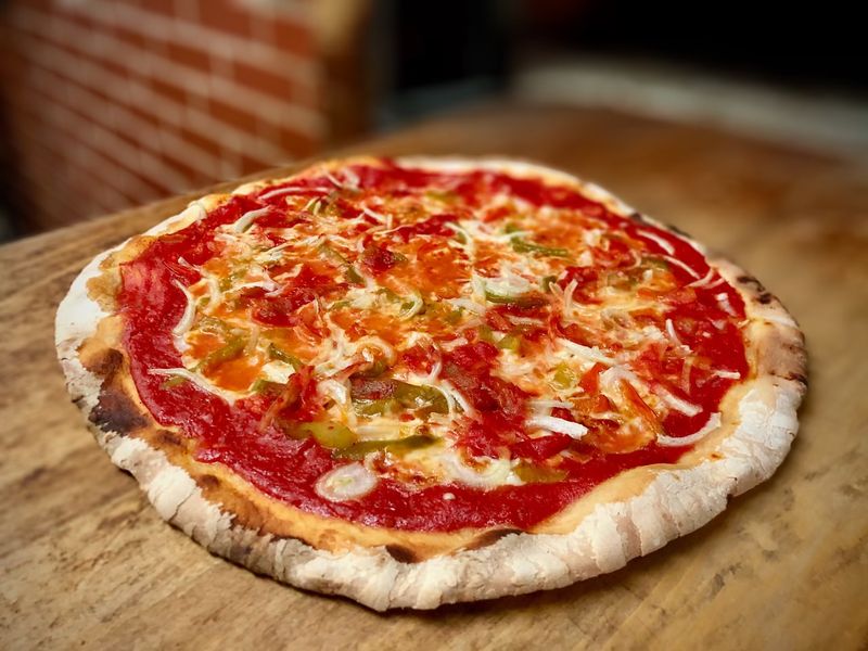 Why The Thin-Crust Tomato Pie Keeps People Coming Back Why The Thin-Crust Tomato Pie Keeps People Coming Back