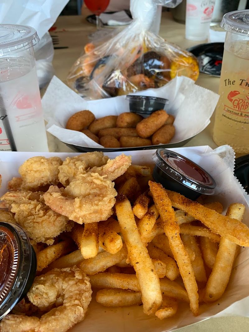 Crispy sides wings and fried baskets for everyone at the table Crispy sides wings and fried baskets for everyone at the table