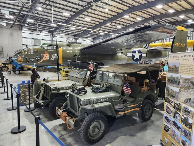 Military vehicles and wartime artifacts add depth