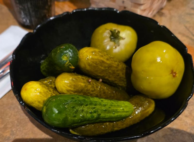 The pickle bowl and sides set the tone