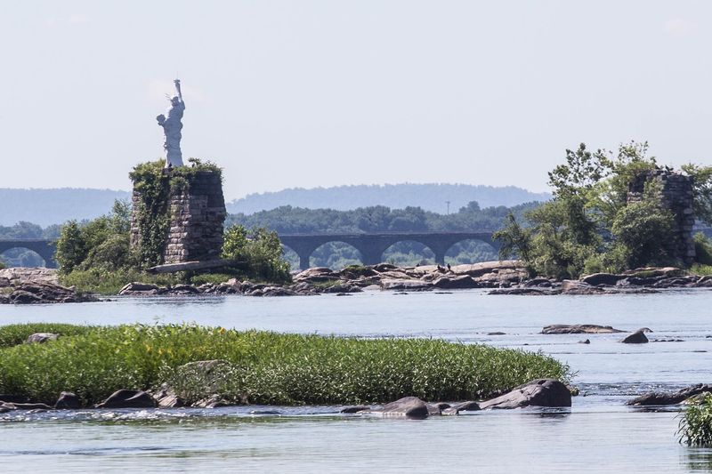 The unusual history behind the river statue