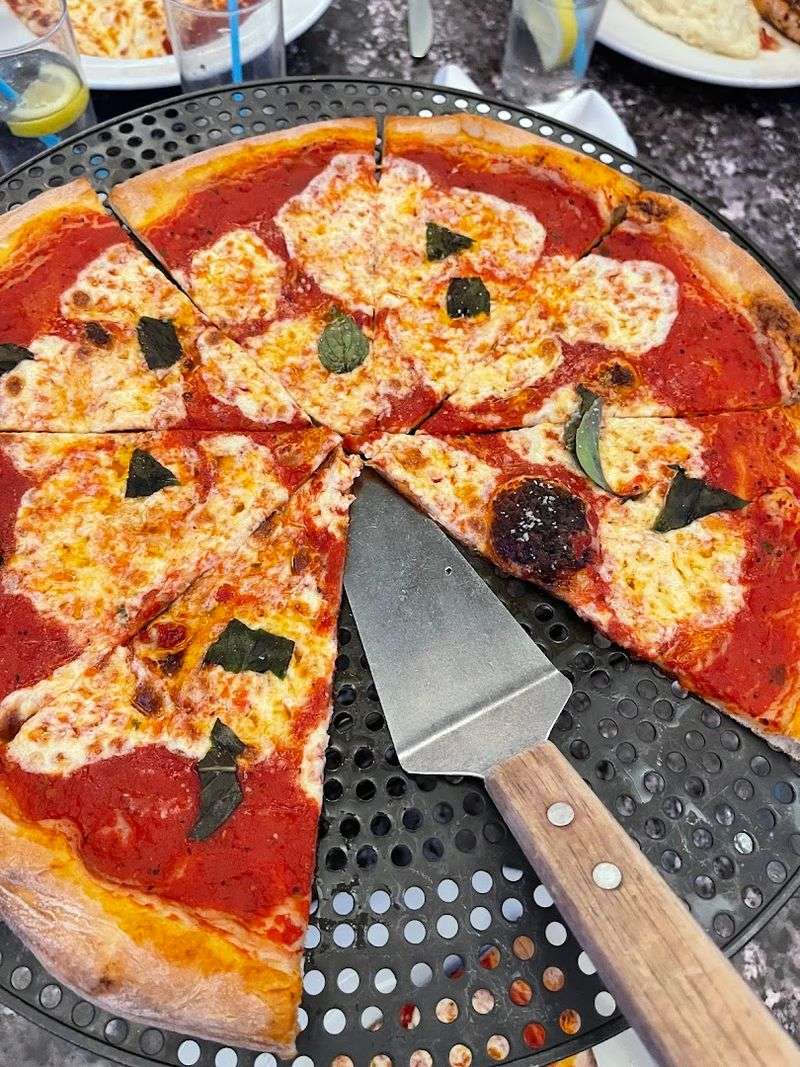 Wood Fired Pizza and Seafood Keep the Table Busy Wood Fired Pizza and Seafood Keep the Table Busy