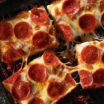 Cheese, Crust, And Local Pride Rule At These 13 Michigan Pizza Favorites