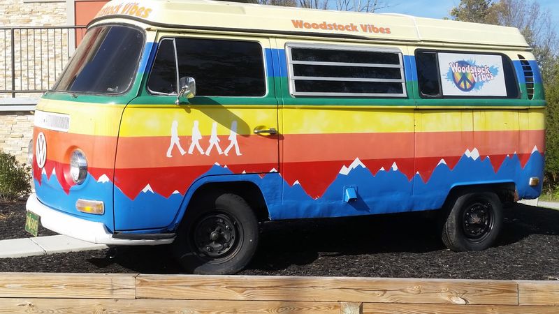 A Tie-Dyed Volkswagen Bus Turns the Parking Lot Into the First Stop on a Time-Traveling Shopping Trip A Tie-Dyed Volkswagen Bus Turns the Parking Lot Into the First Stop on a Time-Traveling Shopping Trip