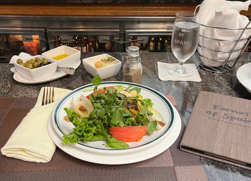 Complimentary Bread, Olives, and Salad Start the Meal on a Generous Note