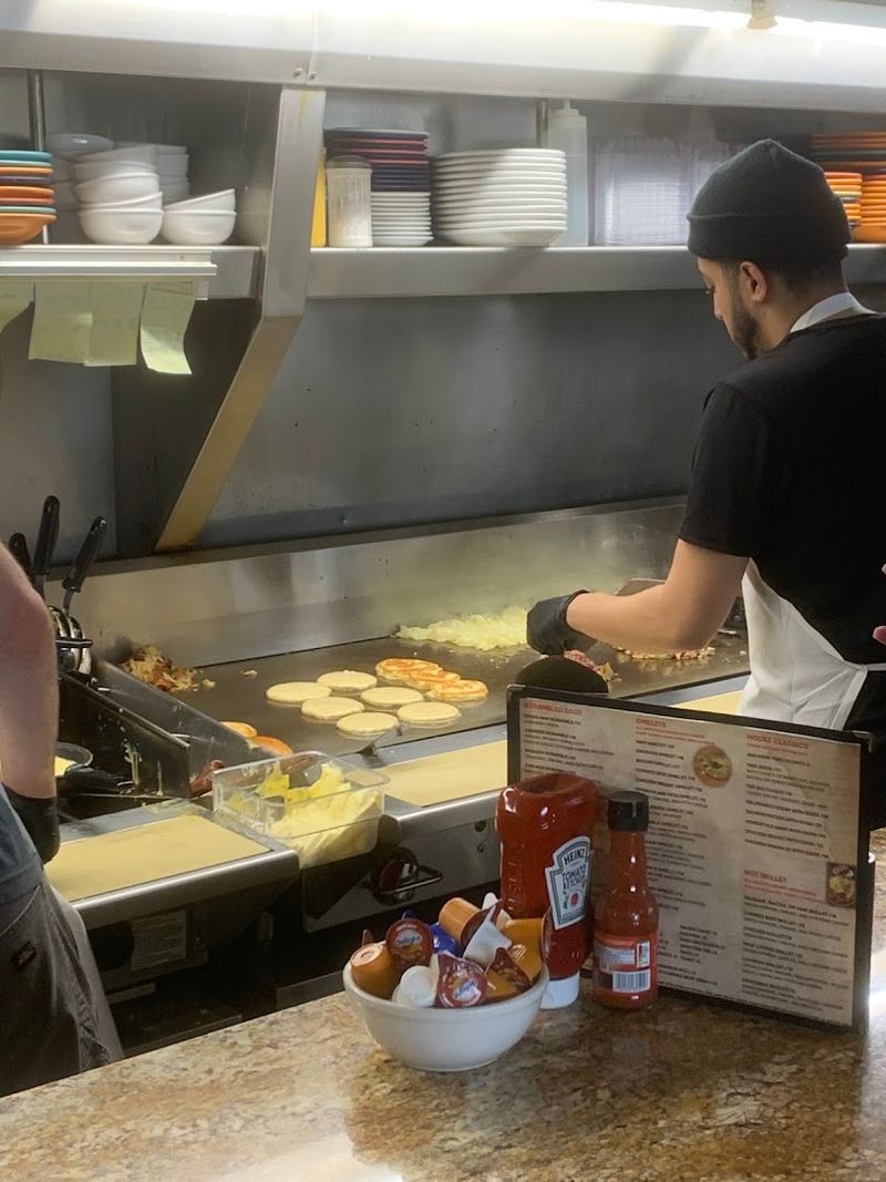 Counter seats and a visible grill turn breakfast into a front-row show Counter seats and a visible grill turn breakfast into a front-row show