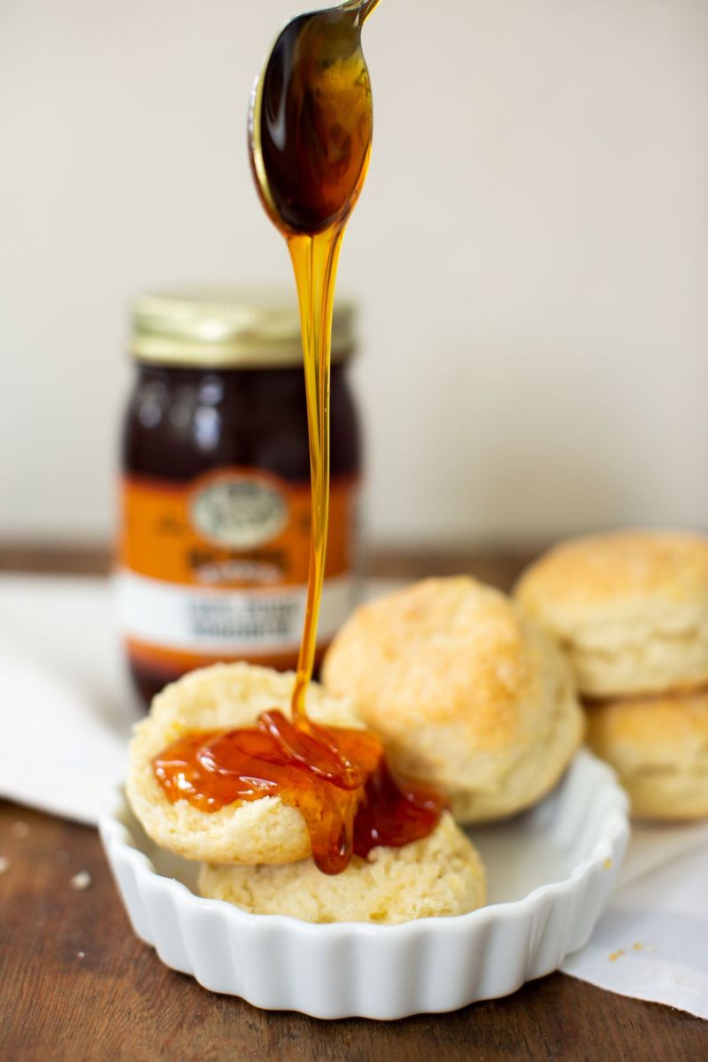 Pouring Sorghum Syrup Over Hot Biscuits Pouring Sorghum Syrup Over Hot Biscuits