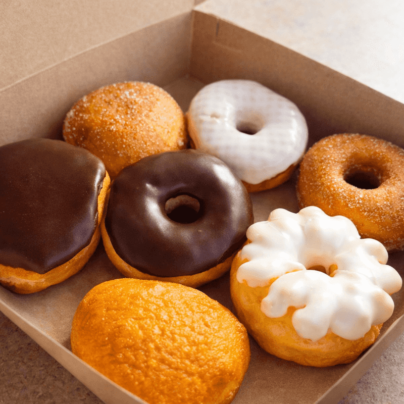 Powdered sugar and pillowy dough make the jelly donuts deliciously difficult to eat neatly