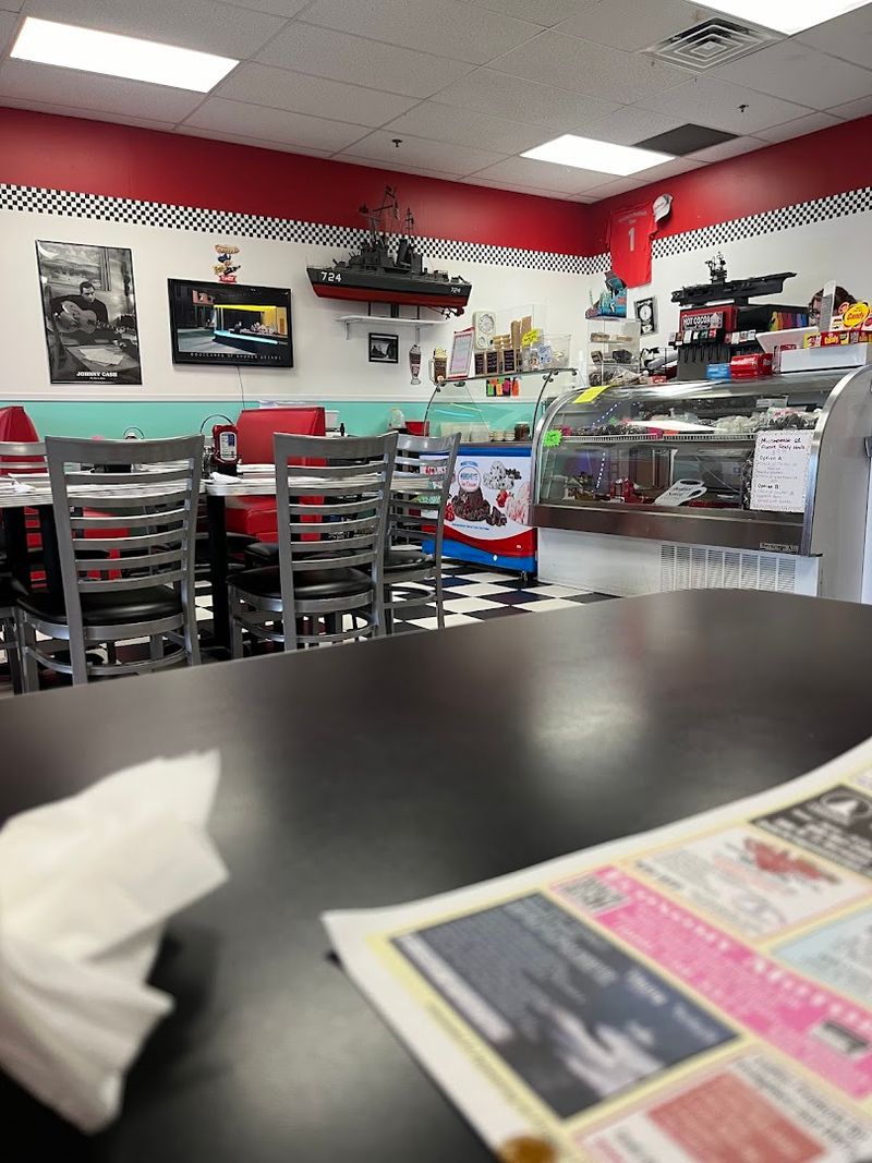 Red vinyl booths, checkered floors, and a jukebox complete the time warp