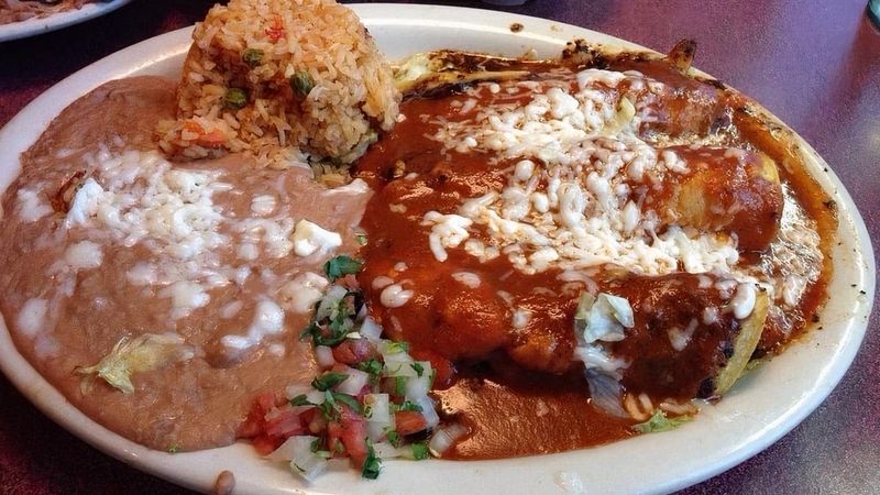 The Enchiladas Arrive Covered In Cheesy, Saucy Goodness