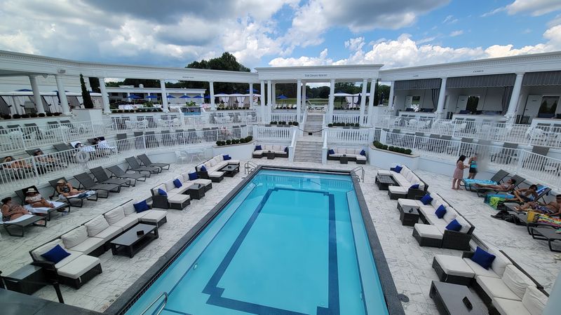 The pool scene feels polished and upscale