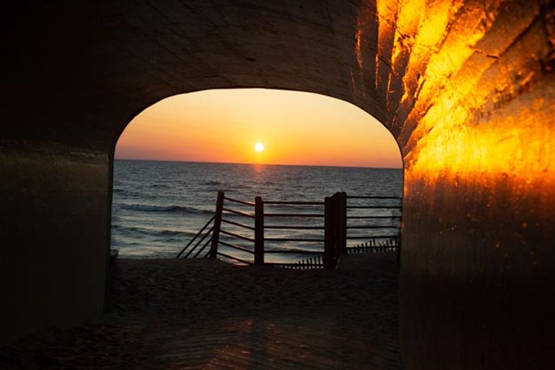 The tunnel entrance turns beach access into an adventure