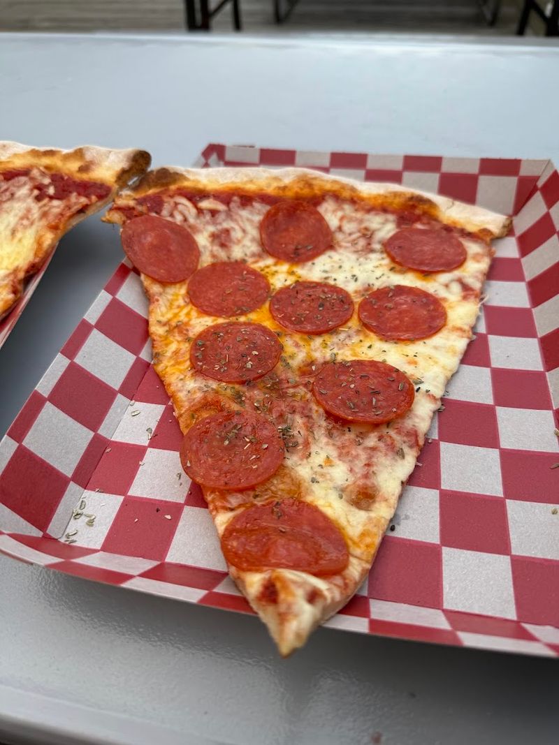 Thin Crust and a Classic Boardwalk Fold Keep the Giant Slice Together