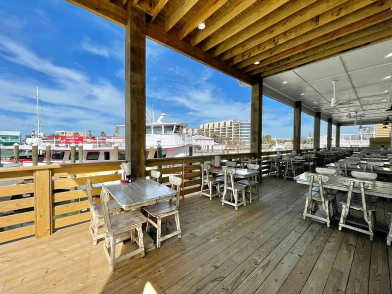 Waterfront Dining With Working Boat Traffic