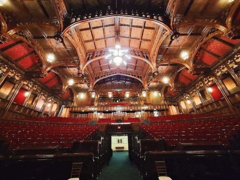 Inside the Great Hall, Red Velvet Meets Carved Wood