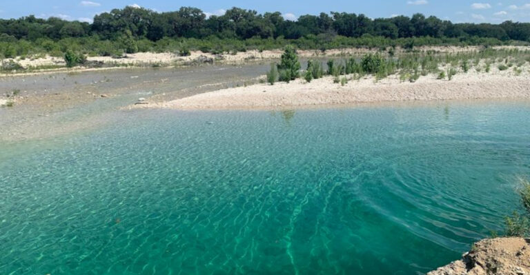 This Crystal-Clear Texas Oasis Has Limestone Cliffs, Blue Water, And Almost No Crowds
