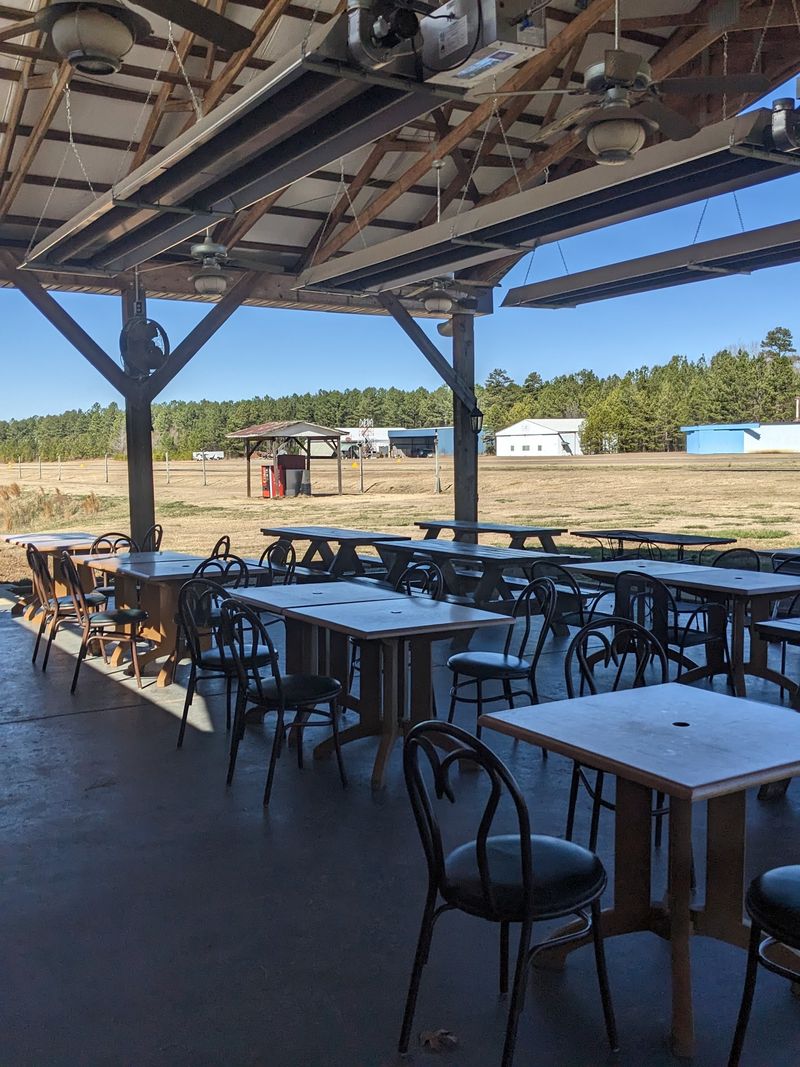 A Barbecue Table Next to a Working Runway A Barbecue Table Next to a Working Runway